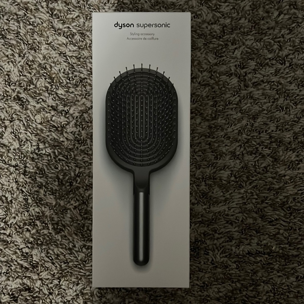 Brand new Dyson paddle brush. Nickel/black